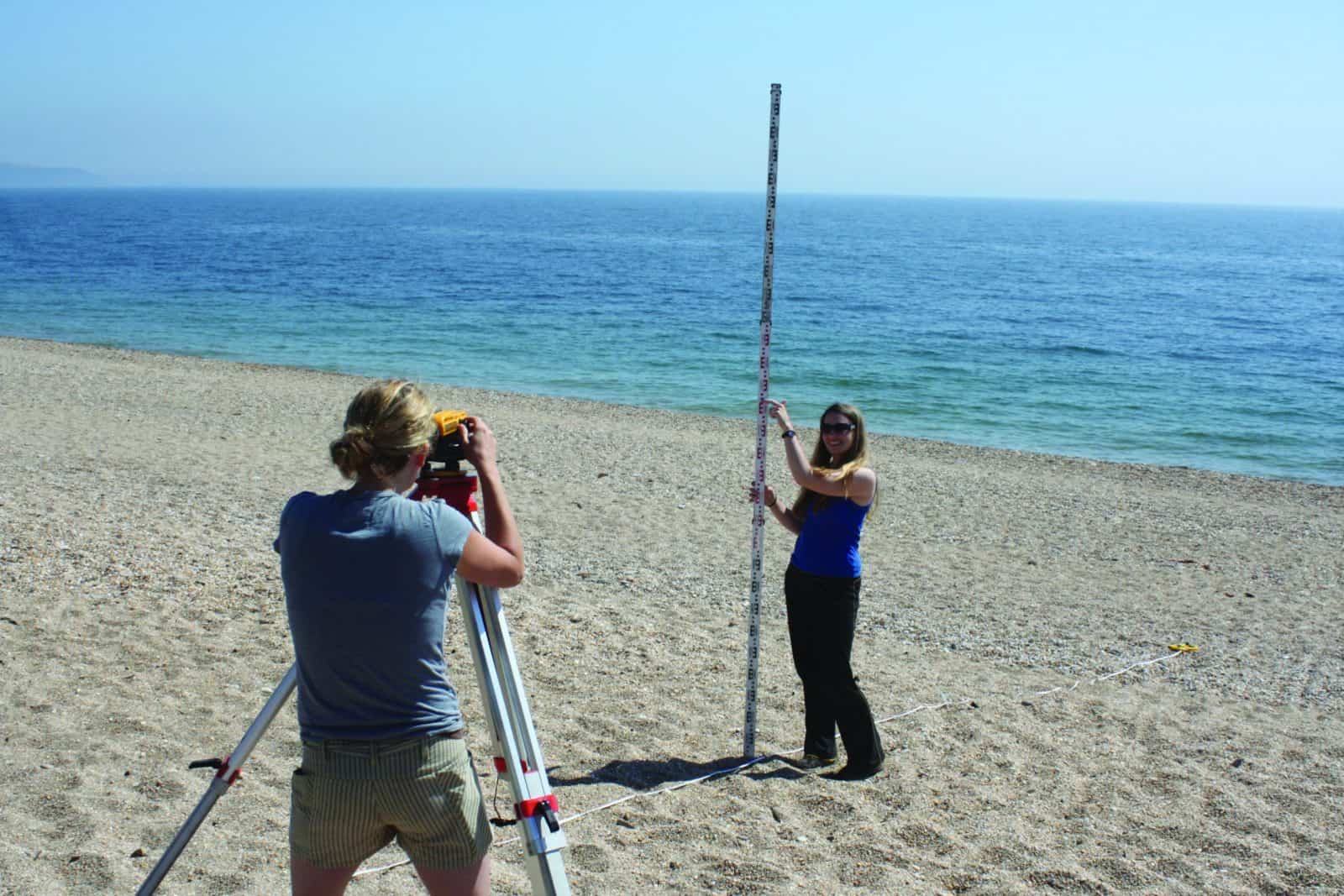 A level geography students on a beach