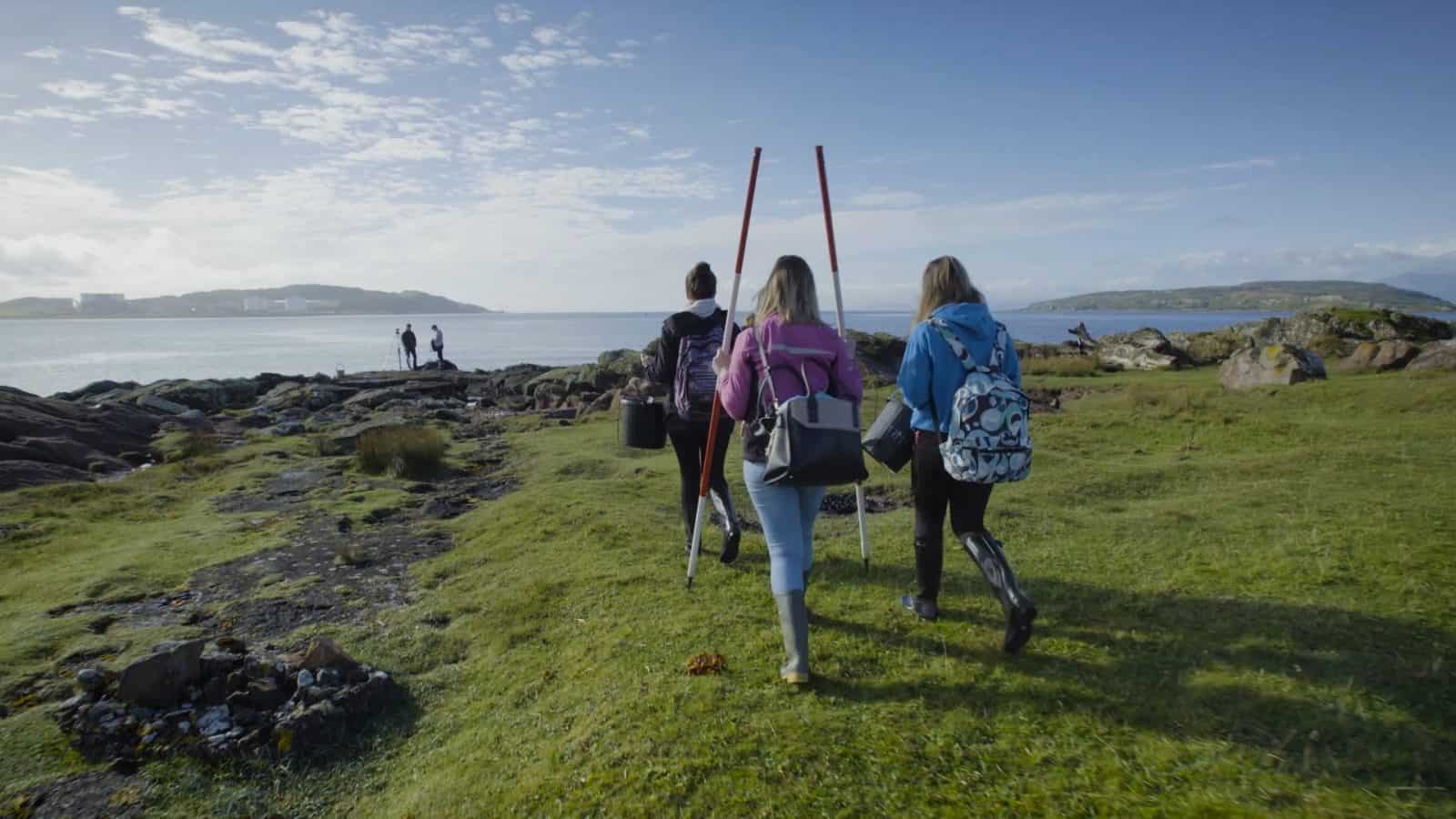 A level students walking to the coast to study biology