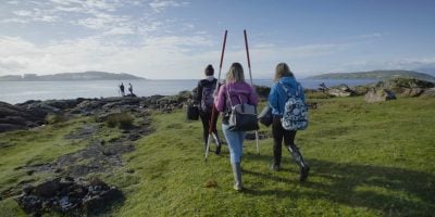 A level students walking to the coast to study biology