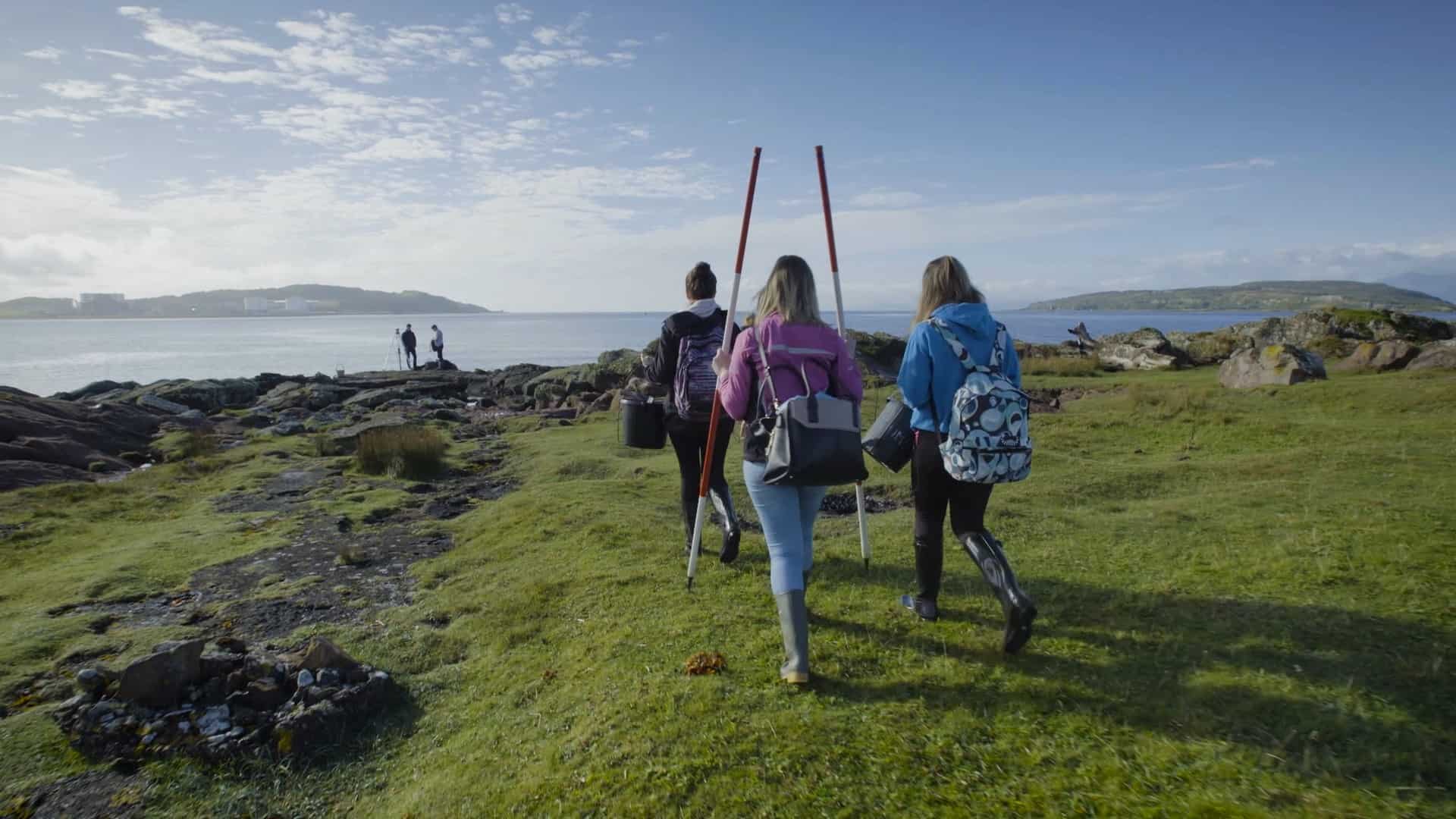 A level students walking to the coast to study biology