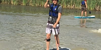 Boy on a stand up paddleboard