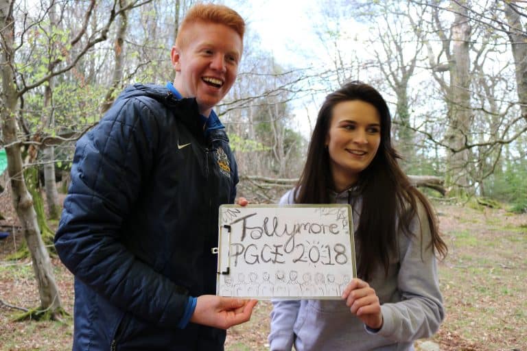 PGCE 2018 holding up sign in Tollymore