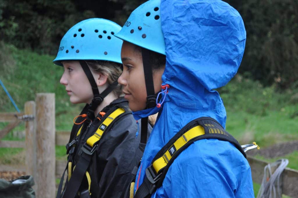 Students getting ready to go on the high ropes