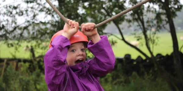 Child on the low ropes at Castle Head