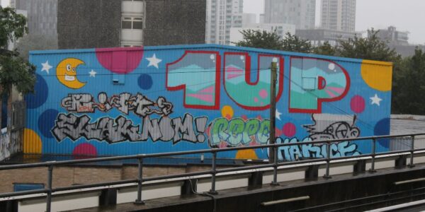 Stratford image of graffiti in front of tower block