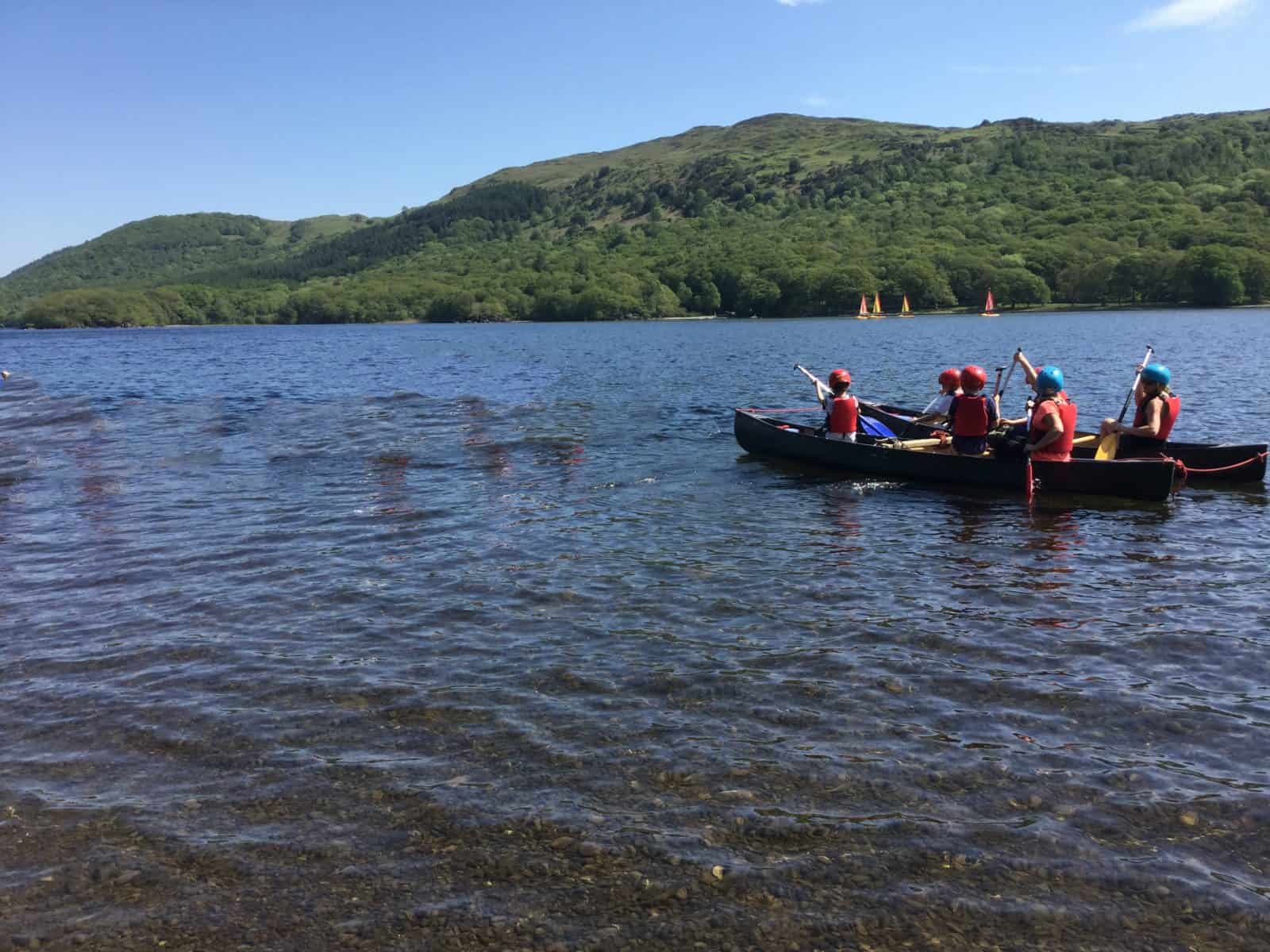 Children Canoeing on a Lake