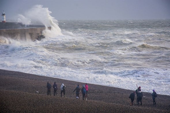 Students doing fieldwork at a stormy coast