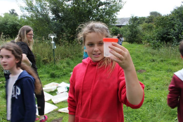 girl holding invertebrate