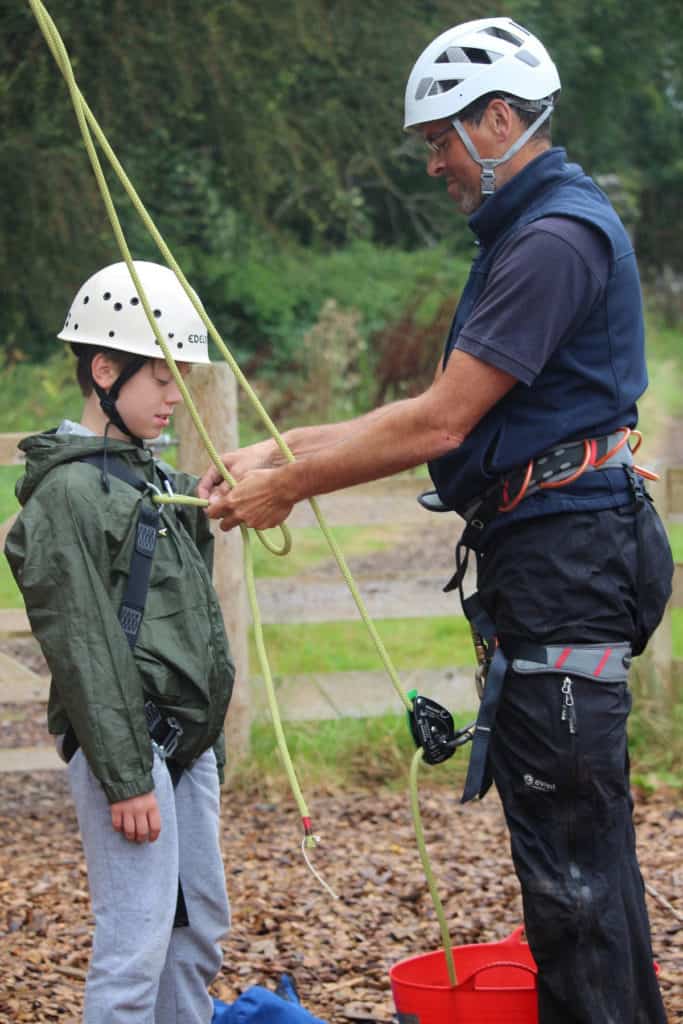 FSC tutor adjusting childs ropes
