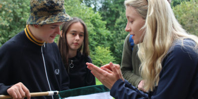 Young Darwin Scholars identifying insects with Holly Dillon