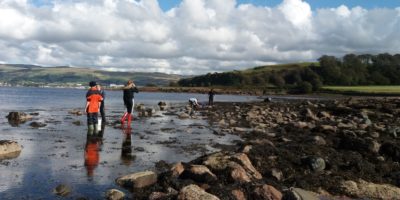 Students surveying the rocky shore at FSC Millport