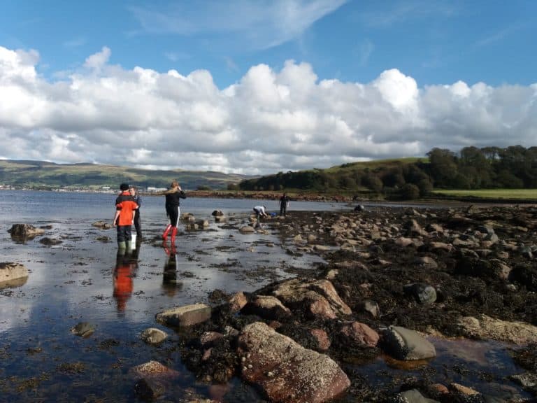 Students surveying the rocky shore at FSC Millport