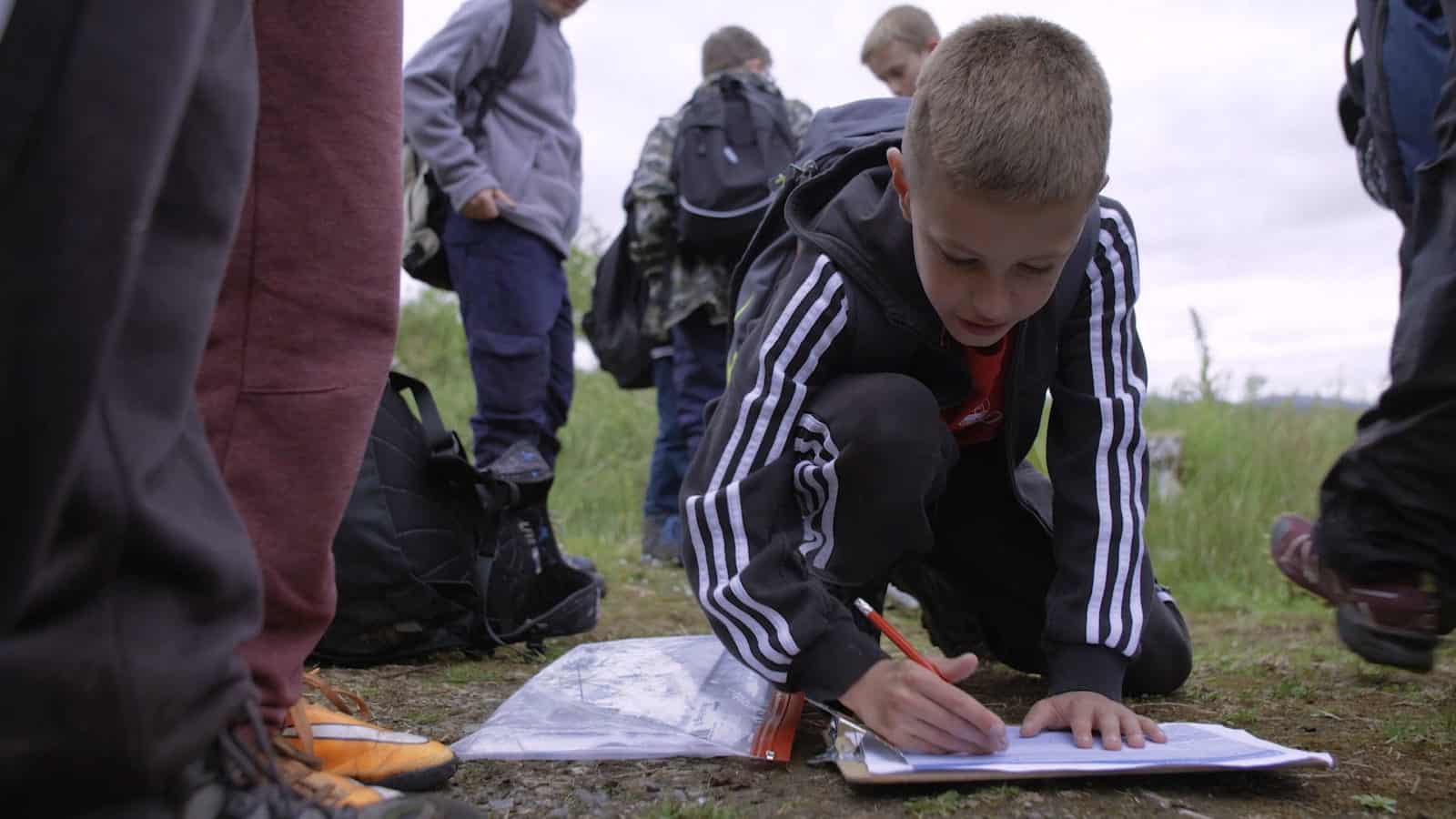 Young boy taking part in Orienteering