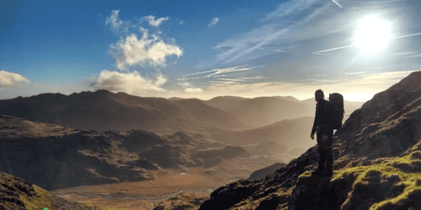 Man walking in the hills