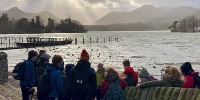 a group of students standing infront of freshwater