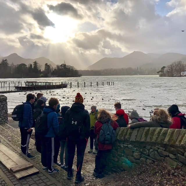 a group of students standing infront of freshwater