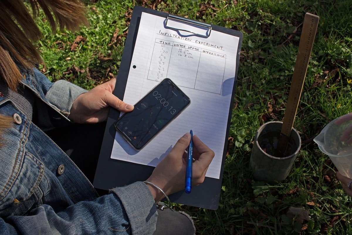 using phone and clipboard outdoors