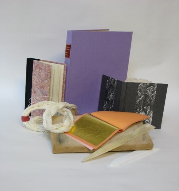 A display of books made on the FSC bookbinding course