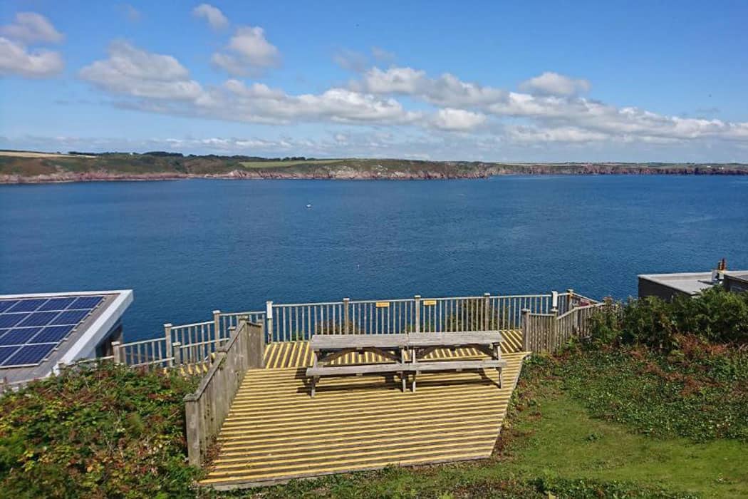 Picnic benches looking out to sea