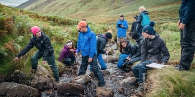 Students studying a river for A Level Biology