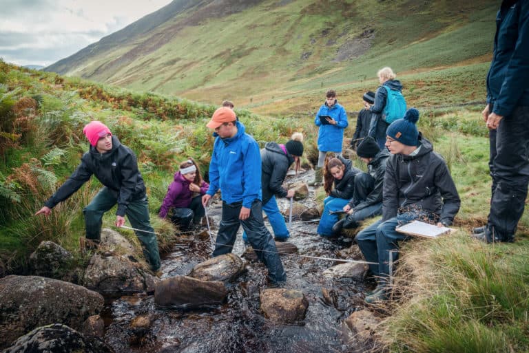 Students studying a river for A Level Biology