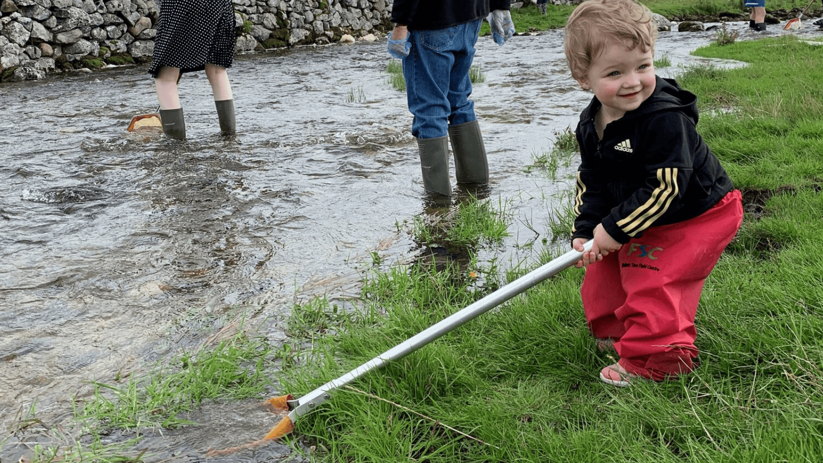 young child pond dipping