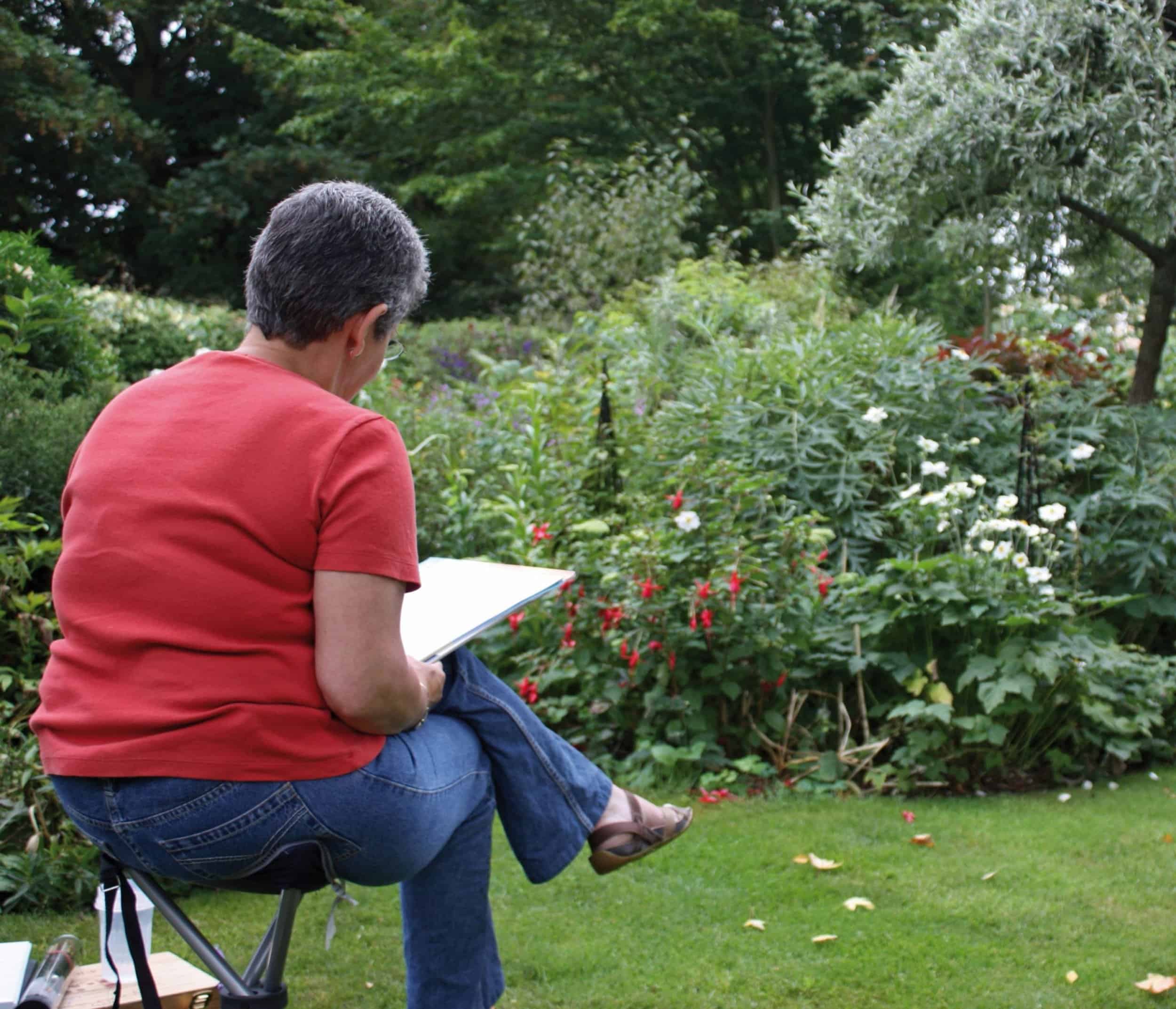 Exploring Nature Writing. Person outside writing. 