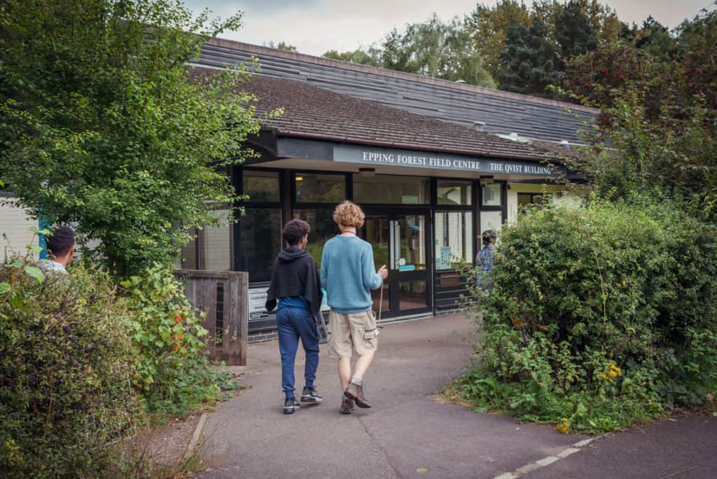 two students walking towards our Epping Forest field centre
