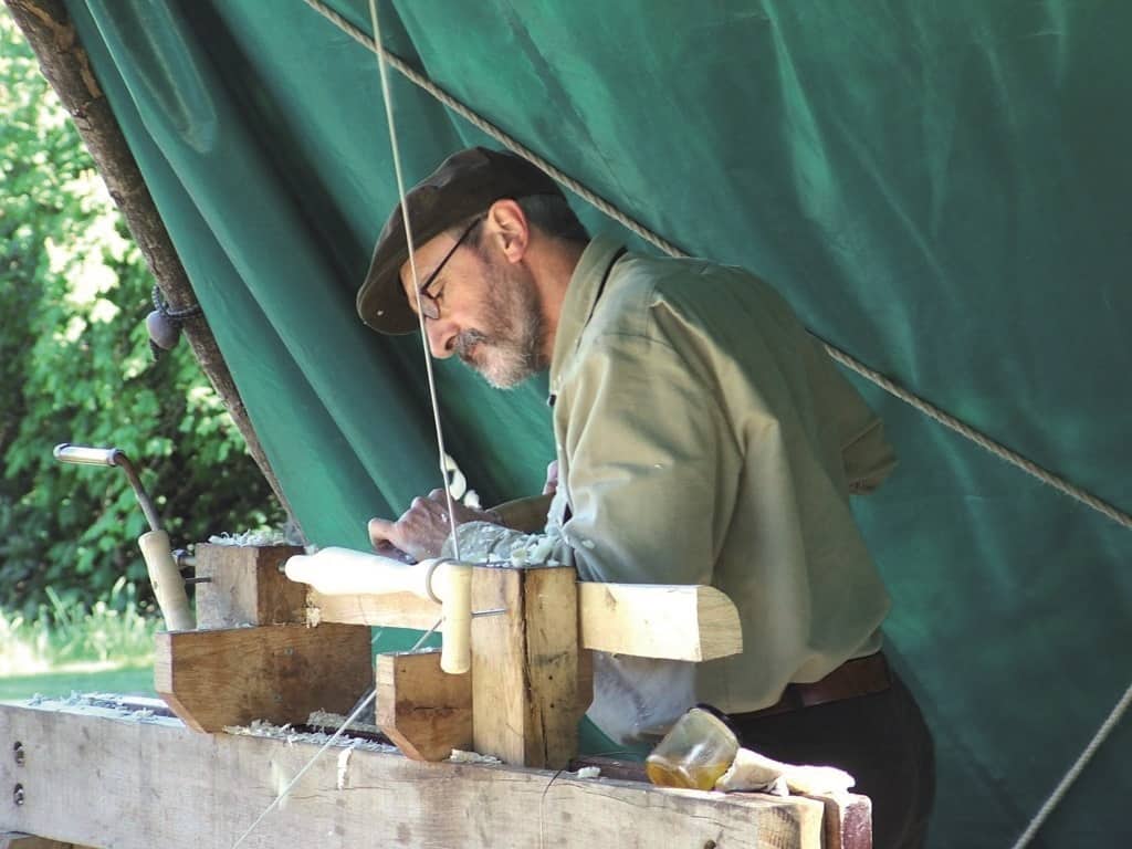 Man carving on a traditional skills course
