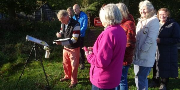 A photo of a past 'Freshen up Your Watercolours' course with Andrew Pitt demonstrating to students.