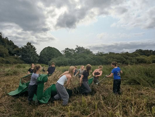 A photograph of a group taking part in conservation work