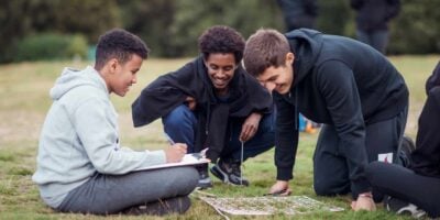 a group of boys studying a transect