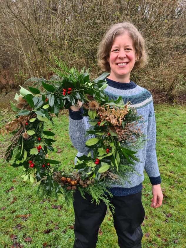 someone holding up their Natural Christmas Wreath