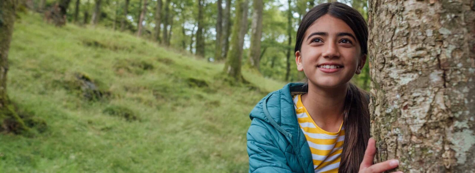 smiling girl in trees
