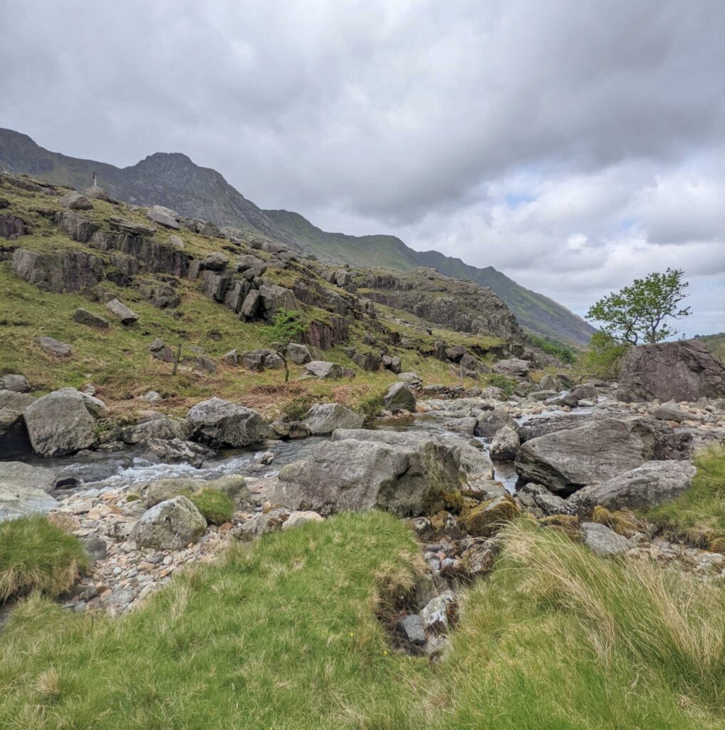 Llanberis Pass, with exposed rock and running water.