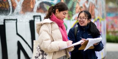smiling students in an urban location