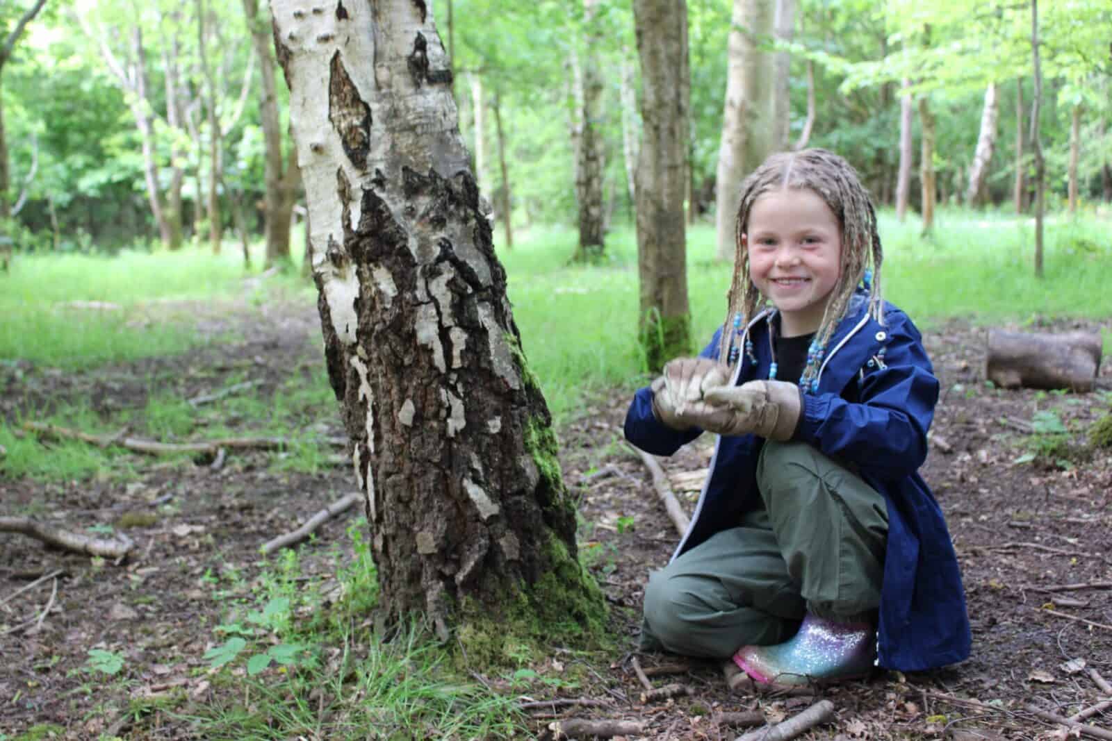 smiling girl in woodland