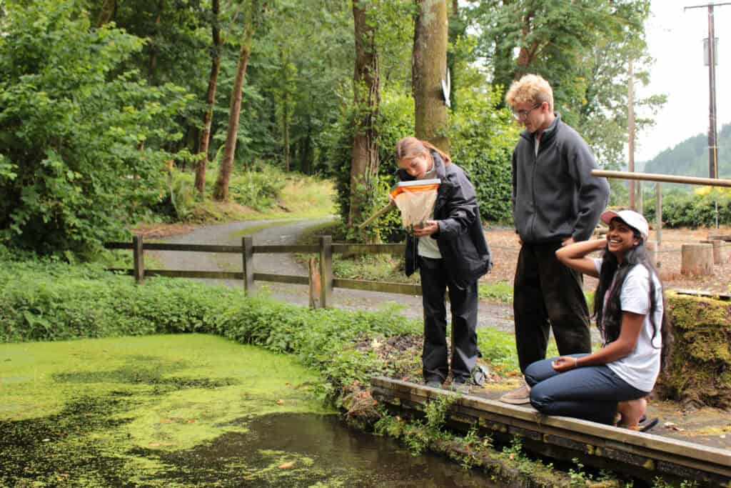 smiling group pond dipping