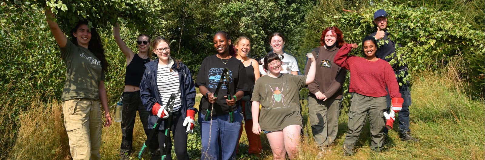 smiling group of young people in the outdoors