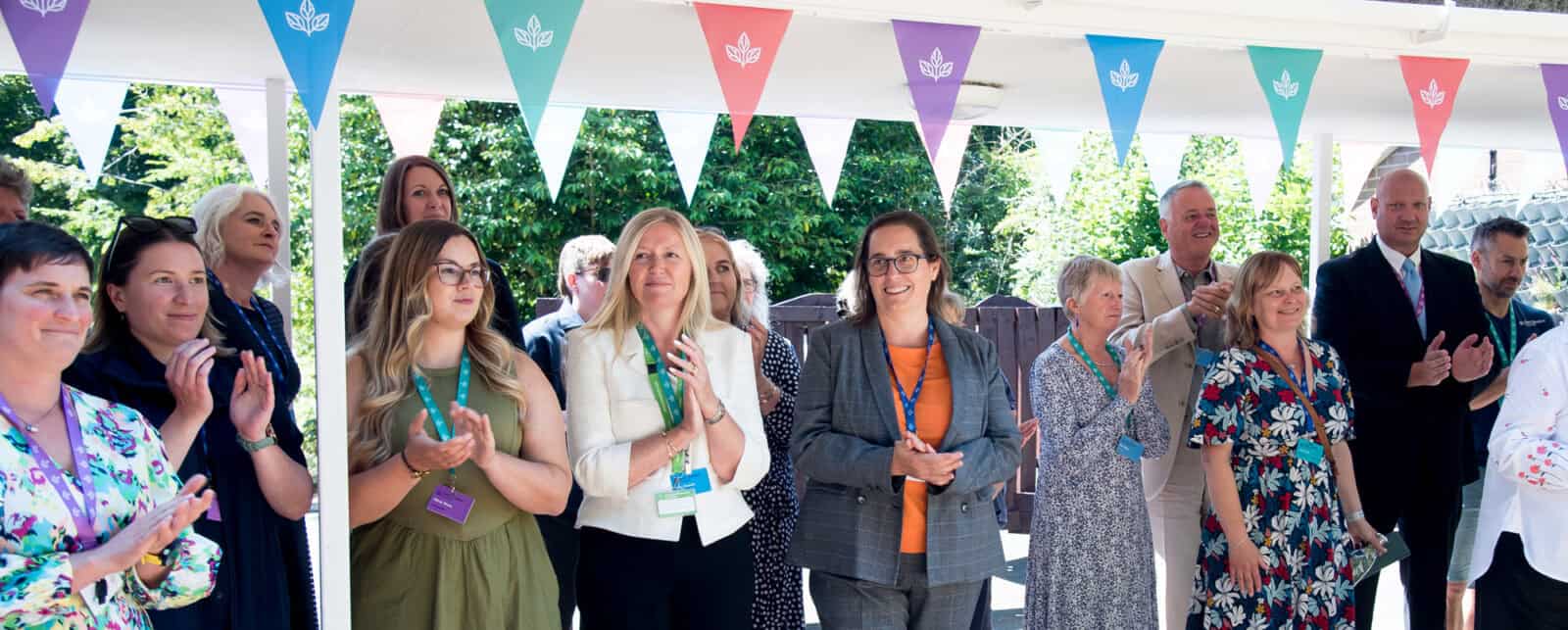 group of smiling staff
