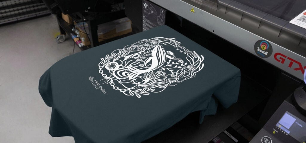Navy blue t-shirt with a white whale print