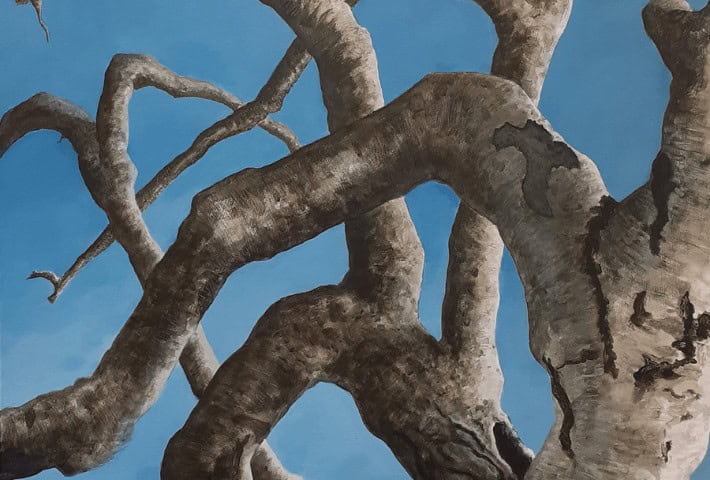 A painting of a tree with a blue sky