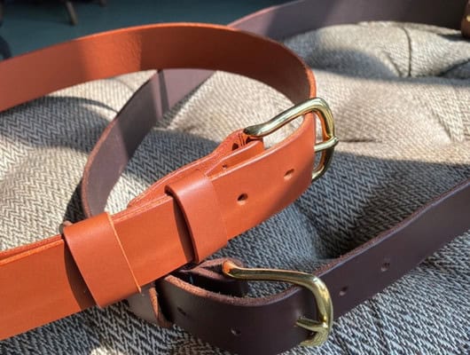 2 leather belts in the sun
