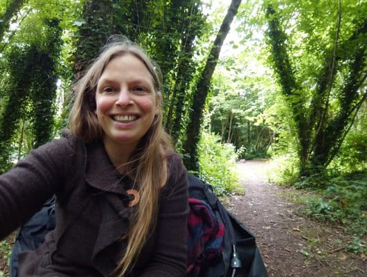 A picture of our tutor Emma Capper in a woodland