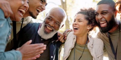 A group of people smiling and laughing