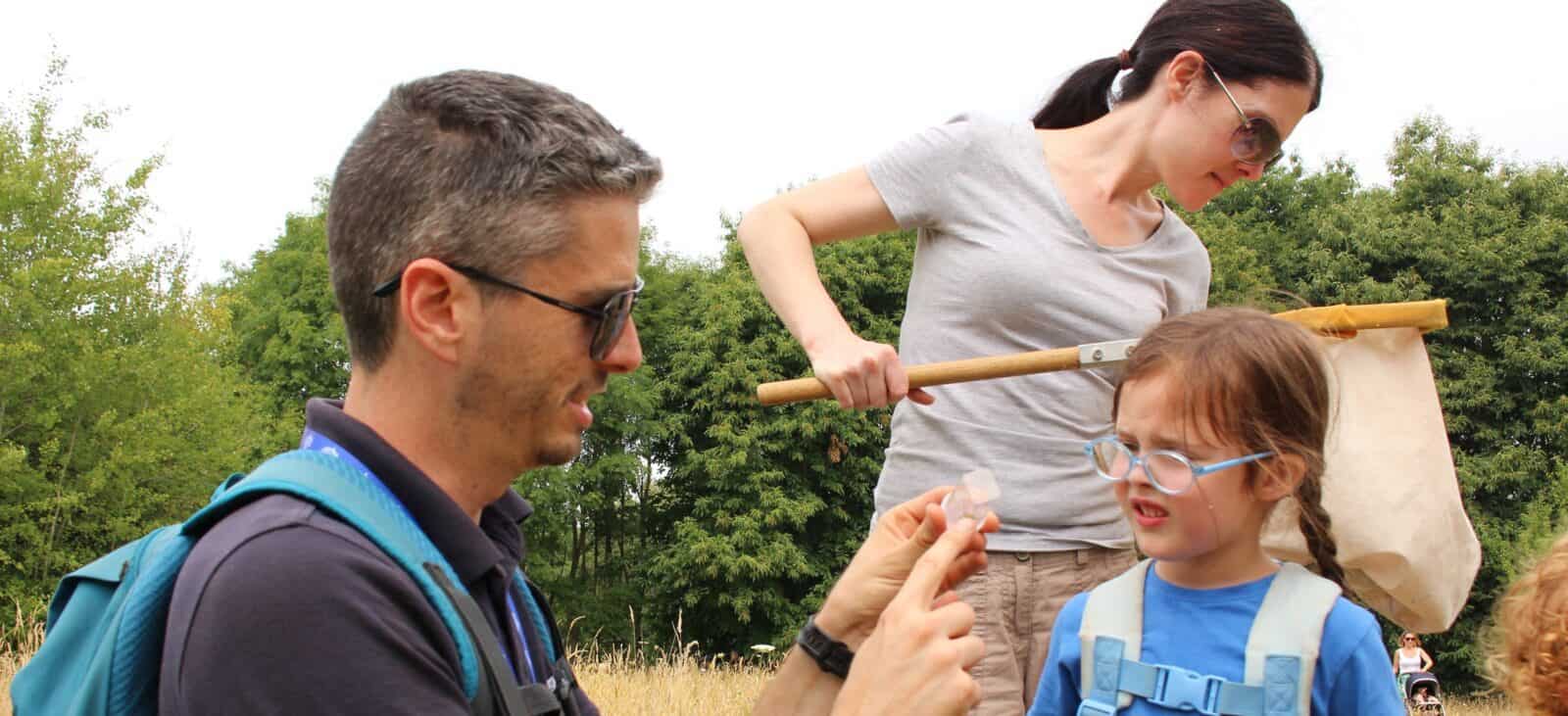mum daughter and tutor insect hunting