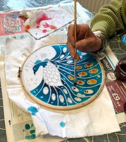 An image of someone creating a batik piece - Beautiful Batik