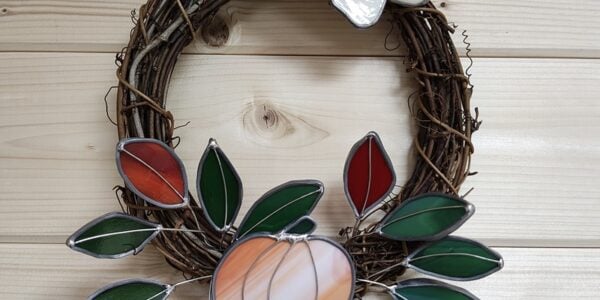 A photo of a stained glass wreath - Stained Glass Autumn Flower Wreath