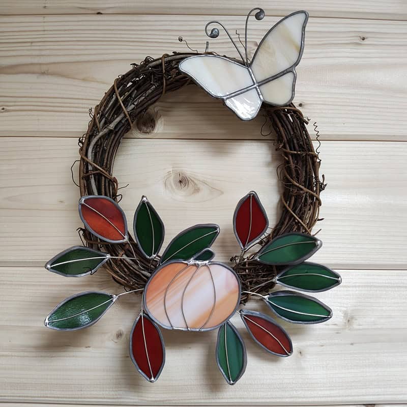 A photo of a stained glass wreath - Stained Glass Autumn Flower Wreath