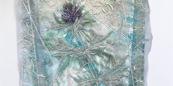 A photo of an embroidery of blue and silver threads - Flatford sketch and stitch,